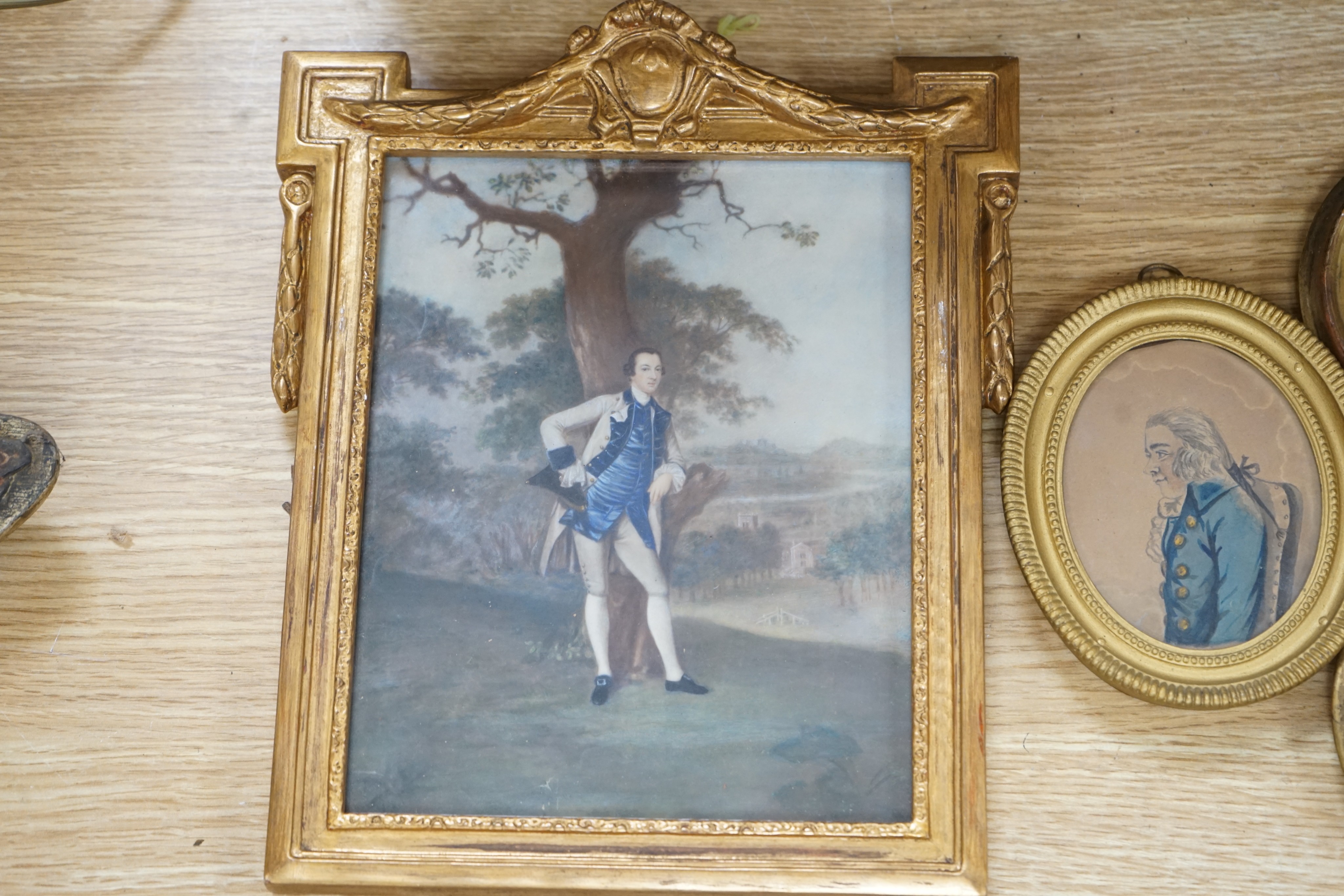 English School c.1900, pair of watercolour on card miniatures, Portraits of Robert Dudley, Earl of Leicester and Lord Burghley, an early 19th century watercolour, miniature of a Georgian gentleman and two gilt framed pri